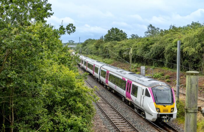 c2c train on train track surrounded by green trees