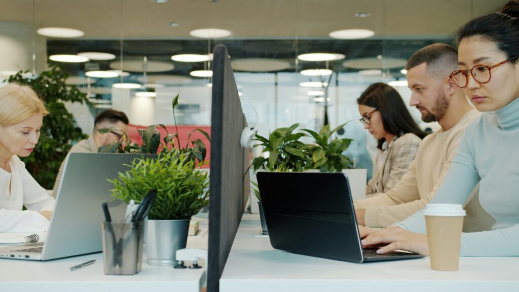 coworkers in an office looking at computers
